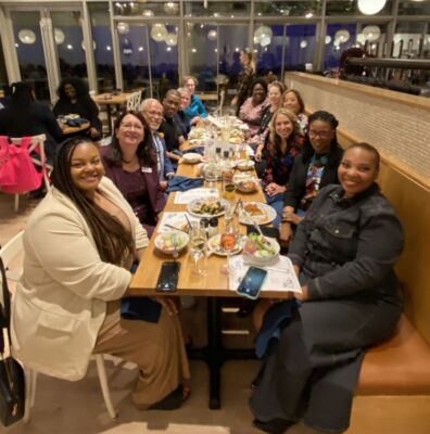 A group of people sitting at a dining table